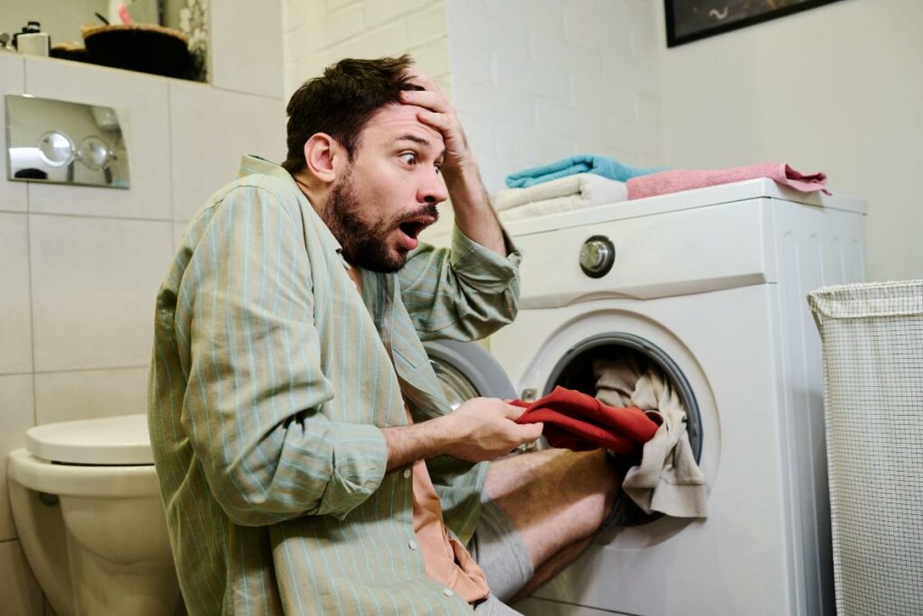 pulling-red-attire-from-washing-machine