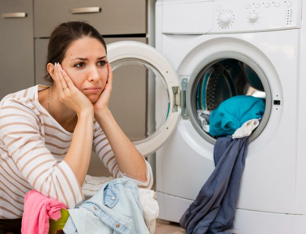 stressed-woman-doing-laundry-medium-shot